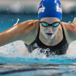 Kate Douglass Breaks Back 50m Freestyle World Record at Pan Pacs Prelims — AI-generated editorial illustration